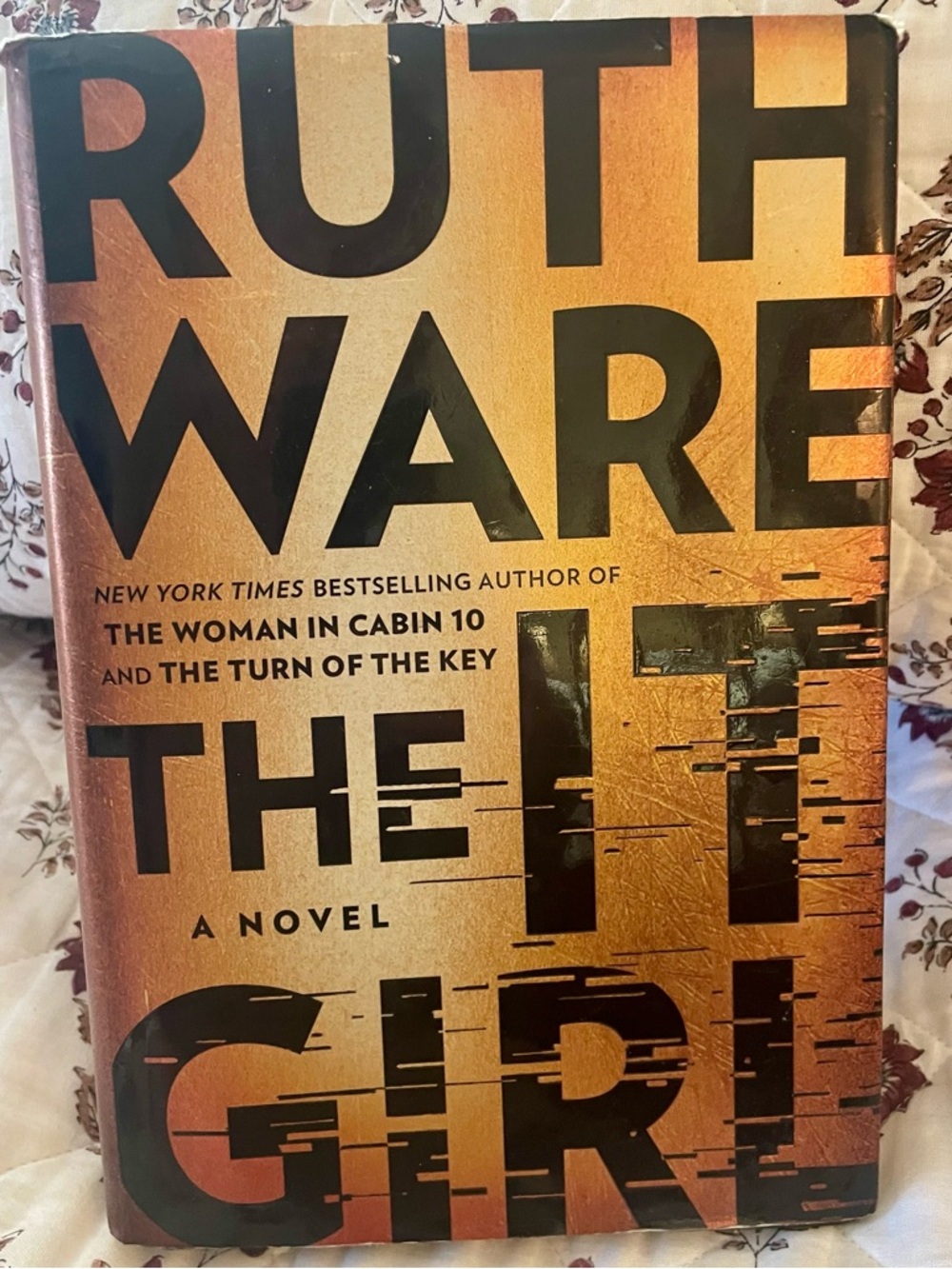 Ruth Ware "The It Girl" Hardcover - Metallic Orange & Black